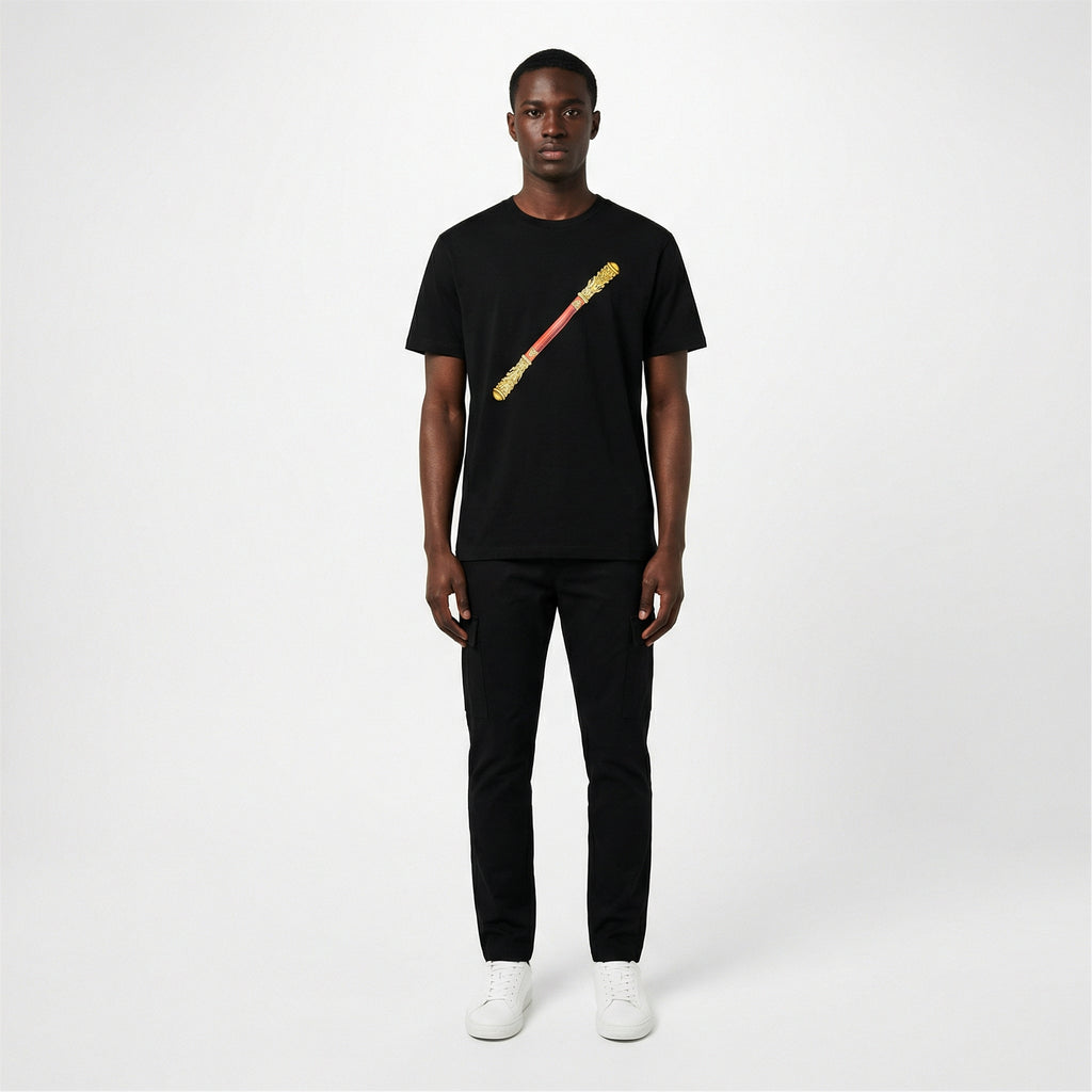 Black male model wearing black Sun Wukong Golden Cudgel tee, gold staff graphic