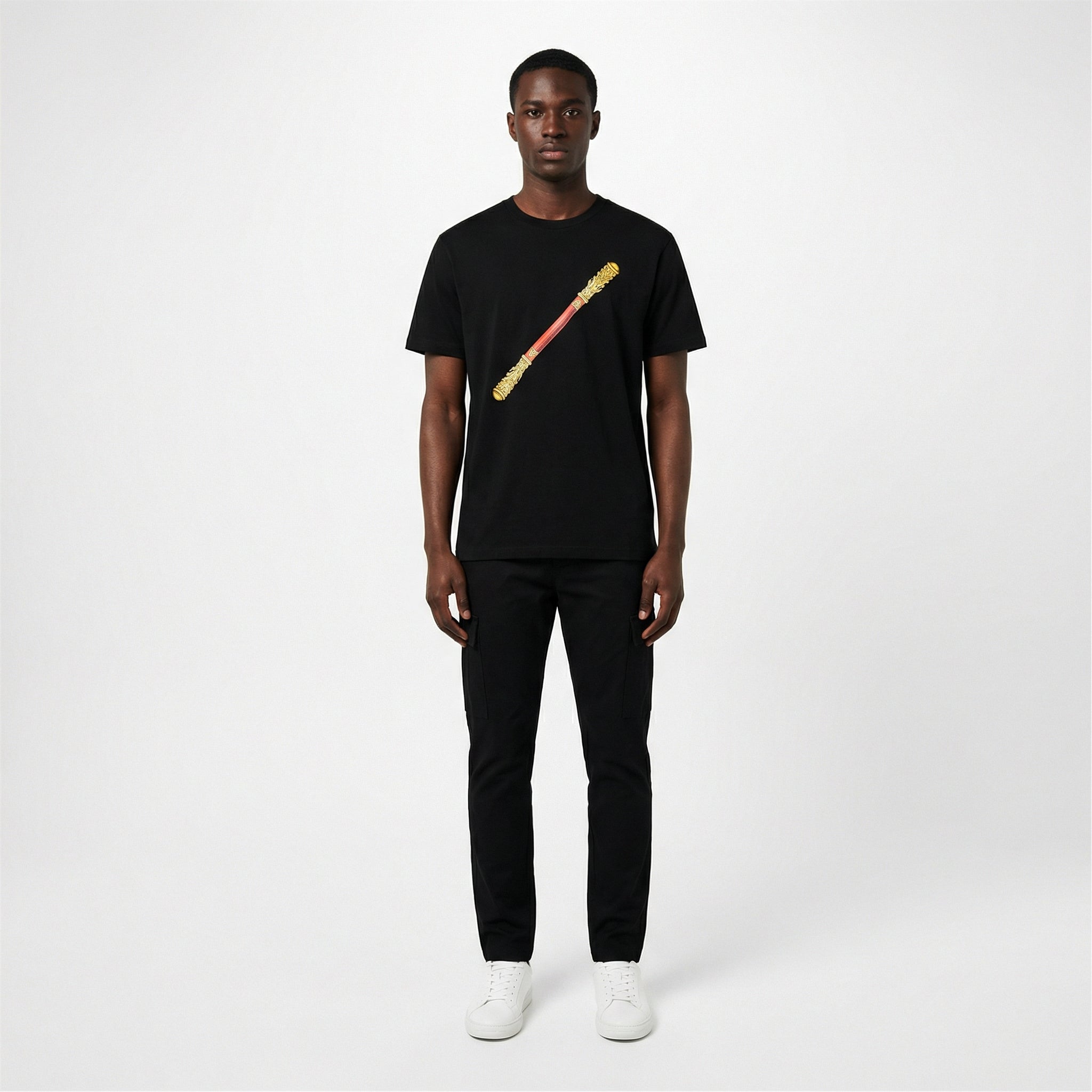 Black male model wearing black Sun Wukong Golden Cudgel tee, gold staff graphic